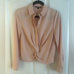 Never worn blouse. The color is a pink, beige peachy nude very neutral.